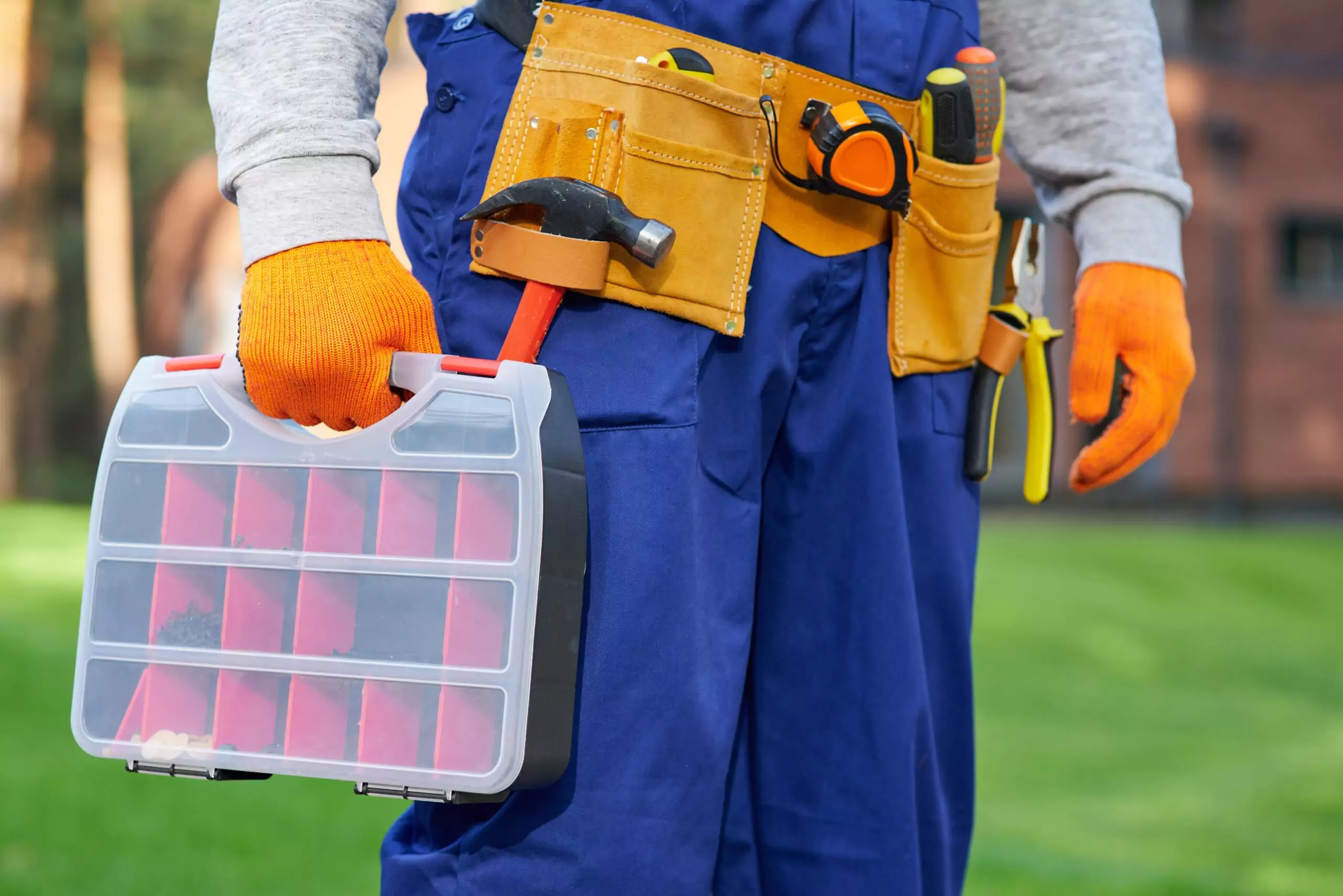 male-builder-wearing-tool-belt-carrying-toolbox-at-2021-09-03-20-52-51-prime-one-builders