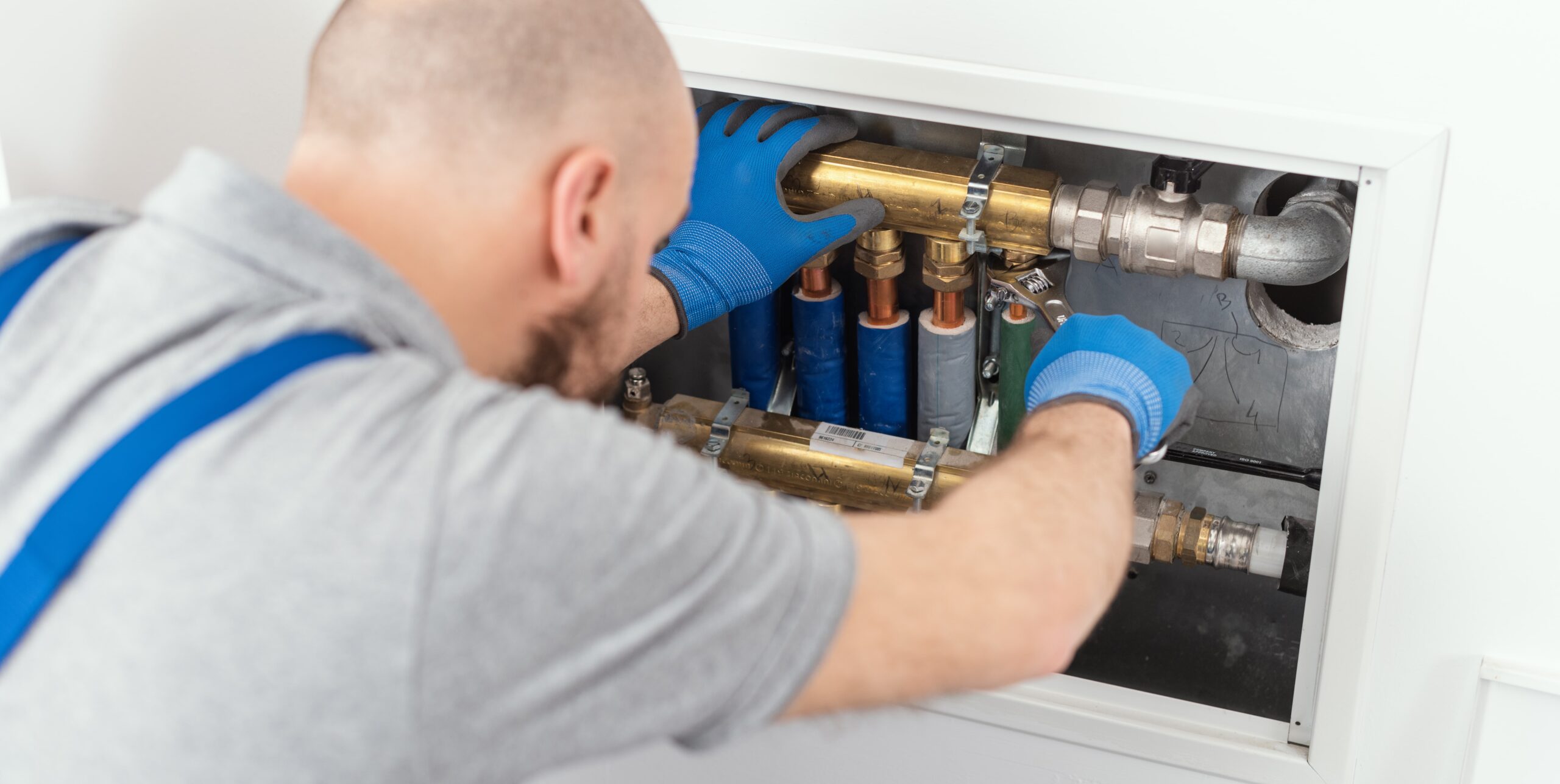 professional-plumber-installing-plumbing-manifolds-12-14-03-50-58-prime-one-builders