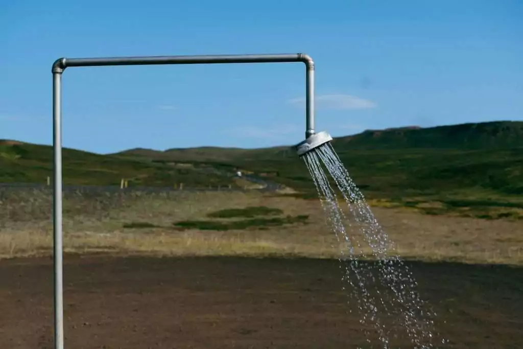 a sprinkle of water is coming out of a pipe